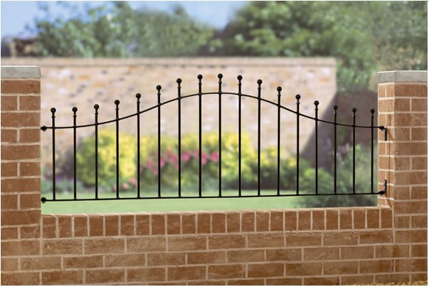 professionally fitted black metal railing on a brick wall